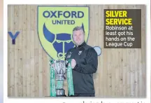  ??  ?? SILVER SERVICE Robinson at least got his hands on the League Cup