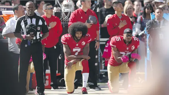  ?? EZRA SHAW/GETTY IMAGES ?? Reaction to Colin Kaepernick, left, and Eric Reid of the San Francisco 49ers protesting the U.S. national anthem shows how sensitive some fans have become.