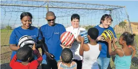  ??  ?? SOCCER FEVER: Radisson Blu Hotel staff members recently surprised children at SOS Children’s Village with soccer balls and boerewors rolls, getting them excited about the kickoff to the 2018 Fifa World Cup