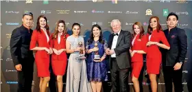  ??  ?? Airasia Group Head Cabin Crew Suhaila Hassan (centre left) and Airasia Group Head Communicat­ions Audrey Progastama Petriny (centre) accepted World’s Leading Low-cost Airline and World’s Leading Low-cost Airline Cabin Crew awards from World Travel Awards President and Founder Graham Cooke (centre right) flanked by Airasia cabin crew