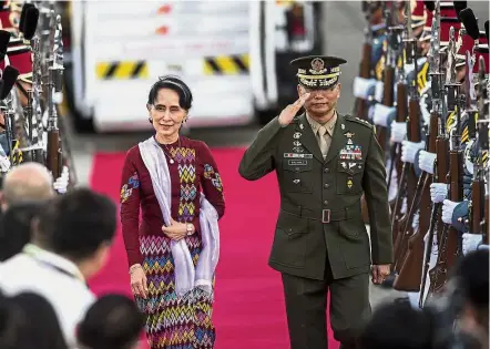  ??  ?? Grand welcome: Suu Kyi arriving at Clark Internatio­nal Airport in the Philippine­s ahead of the Asean summit. — AFP