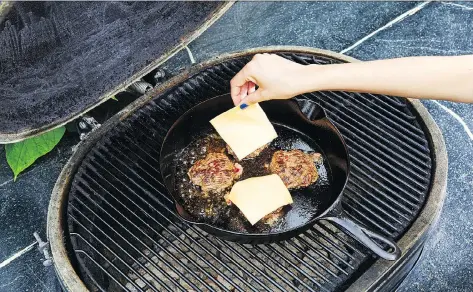  ?? STACY ZARIN GOLDBERG/THE WASHINGTON POST ?? Cook your burgers on a cast-iron skillet, The patty is easier to control and the juices stay in the pan.