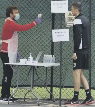  ??  ?? 3 St Mirren defender Jack Baird undergoes a temperatur­e test at the club’s training ground in Ralston.