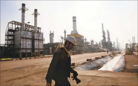  ?? Vahid Salemi Associated Press ?? THE U.S. says it won’t extend exemptions on its Iranian oil import ban. Above, an Iranian oil worker at a refinery south of Tehran in 2014.