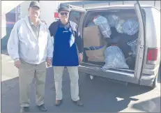  ?? Courtesy photo ?? Paul Moxley, left, and David Holycross said the eighth annual Donation Station had received a van full of donations by noon on Thursday.