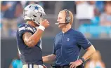  ?? JASON E. MICZEK/ASSOCIATED PRESS ?? Dallas QB Dak Prescott, left, confers with coach Jason Garrett during last week’s loss at Carolina.