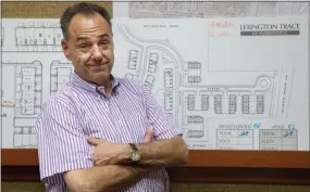  ?? AMR ALFIKY — THE ASSOCIATED PRESS PHOTO ?? Jeff Benach, co-owner of Lexington Homes poses for a portrait inside his office in Chicago. Lexington Homes, which has townhouse and single-family developmen­ts in the Chicago area, has been building smaller projects than in the past, Benach says.