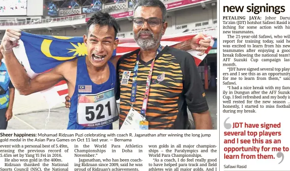  ??  ?? Sheer happiness: Mohamad Ridzuan Puzi celebratin­g with coach R. Jaganathan after winning the long jump gold medal in the Asian Para Games on Oct 11 last year. — Bernama