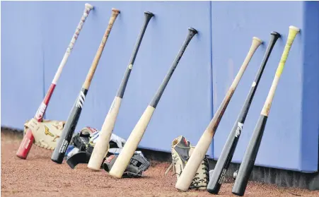  ??  ?? Toronto Blue Jays equipment lines the outfield wall at the team’s training facility in Dunedin, Florida, in February. The Blue Jays’ first home game is scheduled for July 29 against the Washington Nationals.