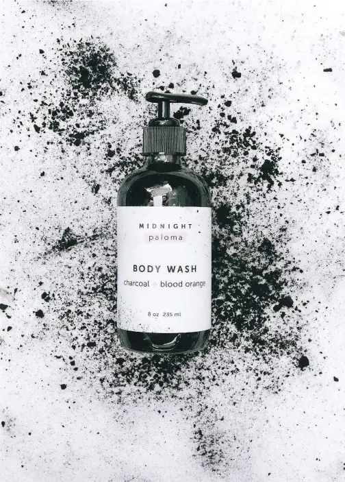  ??  ?? The Charcoal and Blood Orange Body Wash: the two ingredient­s are part of the story behind the brand name.