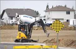  ?? NEWS PHOTO EMMA BENNETT ?? Constructi­on crews work Tuesday to prepare new lots in the Hamptons.