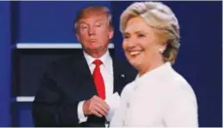  ??  ?? Trump and Clinton finish their final debate at UNLV in Las Vegas, Nevada yesterday.