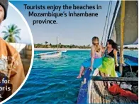  ??  ?? Tourists enjoy the beaches in Mozambique’s Inhambane province.