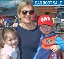  ??  ?? Abi, Gail and Robbie Singleton at the car boot sale at East Glendaloug­h School.