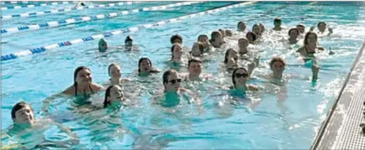  ?? PHOTO BY RALPH RODRIGUEZ ?? The Water Warriors gather for a pool party after clinching the SYML championsh­ip in the varsity boys and girls divisions in Bakersfiel­d.