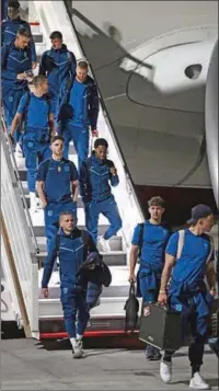  ?? (AFP) ?? England’s players arrive at the Hamad Internatio­nal Airport in Doha on Tuesday, ahead of the FIFA World Cup Qatar 2022. England play their first match against Iran on November 21.