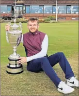  ??  ?? Laird Shepherd with the Amateur Championsh­ip trophy at Nairn