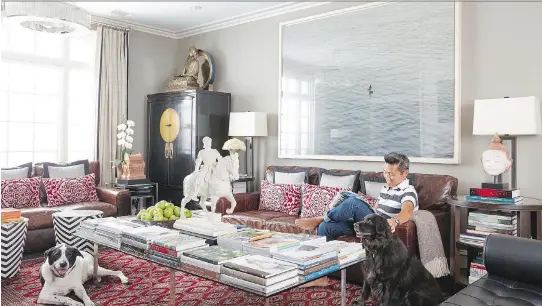  ?? PHOTOS: DAVID A. LAND/VERN YIP ?? Interior designer Vern Yip relaxes at home with his dogs. The home decor industry has “come to realize that this is a way of life for a lot of people,” Yip says.