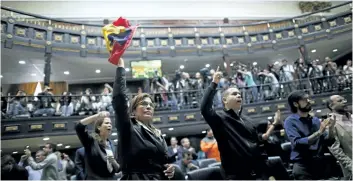  ?? ARIANA CUBILLOS/AP ?? Anti-government lawmakers shout “fraud,” during a session of Venezuela’s National Assembly on Wednesday in Caracas, Venezuela. The National assembly’s claim of a fraudulent election was bolstered when the CEO of the voting technology company Smartmatic...