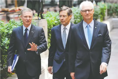  ?? JOCELYN MALETTE /POSTMEDIA NEWS FILES ?? Jeffrey Orr — flanked by Paul Desmarais Jr,, left, and André Desmarais, right — is taking up the reins as CEO will remain chairman and deputy chairman of the board after over 20 years as co-ceos. at Power Corp. The retiring Desmarais brothers