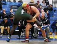  ?? AUSTIN HERTZOG - DIGITAL FIRST MEDIA ?? Boyertown’s Zak Reck, right, tries to take down Methacton’s Tonee Ellis during the 220-pound final at the District 1-AAA Central Tournament.