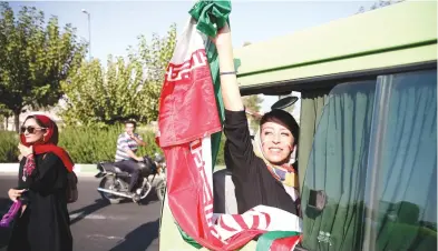  ?? (Nazanin Tabatabaee/WANA) ?? FEMALE IRANIAN soccer fans arrive yesterday to attend Iran’s FIFA World Cup Asian qualifier match against Cambodia.