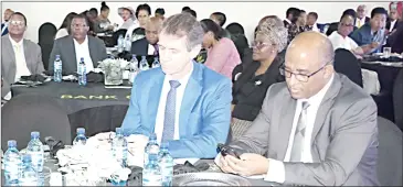  ?? (Pic: Mhlonishwa Motsa) ?? Minister of Finance Neal Rijkenberg (L), Central Bank of Eswatini Governor Dr Phil Mnisi (R) and other guests during the 2023 Post Budget Seminar yesterday at SibaneSami Hotel.