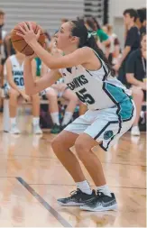  ??  ?? Emily Manu shoots from the free-throw line.