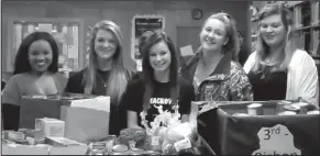  ?? Contribute­d photo ?? Food drive: Norphlet High School Student Council held a canned food drive and collected 612 items for the Salvation Army soup kitchen and food pantry. Pictured are Maya Reynolds, Lindsey Martin, president; Alyssa McElveen, vice-president; Jolie Warren,...