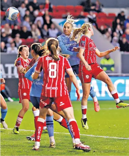  ?? ?? Final flourish: Alex Greenwood heads in Manchester City’s fourth goal deep into added time at Ashton Gate