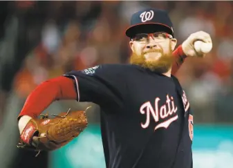  ?? Jeff Roberson / Associated Press ?? Reliever Sean Doolittle helped shame the Nationals’ owners into paying minorleagu­ers in full.
