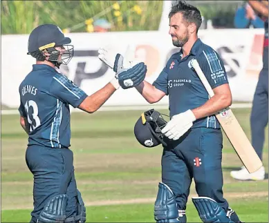  ?? ?? Scotland’s Calum MacLeod (right) celebrates bringing up his century in Aberdeen