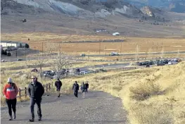  ?? Rachel Ellis, The Denver Post ?? Small groups of people make their way up the North Table Mountain Trail in Golden on Jan. 15.