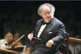  ?? MICHAEL DWYER — THE ASSOCIATED PRESS FILE ?? In this file photo, Boston Symphony Orchestra music director James Levine conducts the symphony on its opening night performanc­e at Tanglewood in Lenox., Mass.