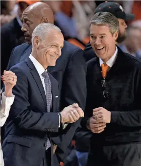  ?? Big 12 commission­er Brett Yormark, left, and Oklahoma State athletic director Chad Weiberg, right, before a men’s basketball game between Oklahoma State and Kansas in Stillwater on Feb. 14. BRYAN TERRY/THE OKLAHOMAN ??