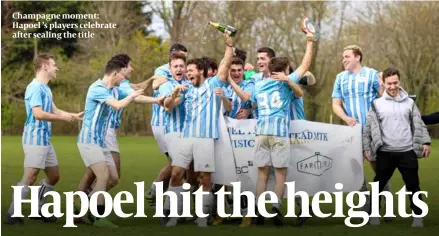  ?? PHOTO: MARC MORRIS ?? Champagne moment: Hapoel ’s players celebrate after sealing the title