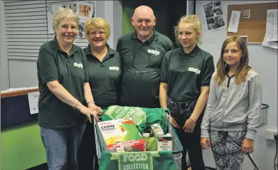  ??  ?? The food bank team in their premises on Fort William High Street.