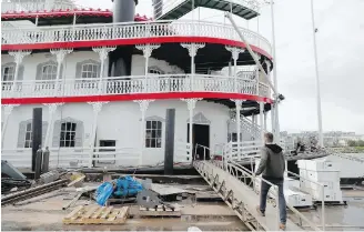  ?? THE ASSOCIATED PRESS ?? Matt Dow, project manager for the restoratio­n of the City of New Orleans riverboat, boards the vessel in New Orleans. The new paddlewhee­l riverboat is ready to ride the Mississipp­i, taking tourists on excursions around the famed Louisiana port city.