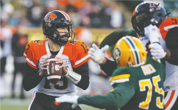  ?? JASON FRaNSON/THE CANADIAN PRESS ?? On the Lions’ second offensive possession of Saturday’s game in Edmonton, QB Mike Reilly suffered what was later revealed to be a broken left wrist.