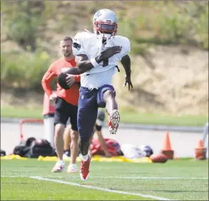  ?? Steven Senne / Associated Press ?? New England Patriots wide receiver Antonio Brown works out during practice on Wednesday in Foxborough, Mass. Brown practiced with the team for the first time on Wednesday afternoon, a day after his former trainer filed a civil lawsuit in the Southern District of Florida accusing him of sexually assaulting her on three occasions.