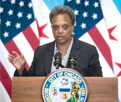  ?? ASHLEE REZIN GARCIA/SUN-TIMES ?? Mayor Lori Lightfoot outlines the city’s grim financial picture Monday in a speech at the Chicago Cultural Center.