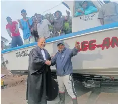  ?? | Supplied ?? NARAINA Puckree Naidoo with his attorney, Mark Tomlinson, and his crew in the 20-foot Kanya Kanya fishing vessel.