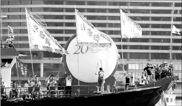  ??  ?? Performers sail on a decorated ship near the area where ceremonies marking the 20th anniversar­y of the city’s handover from British to Chinese rule are taking place. — Reuters photo