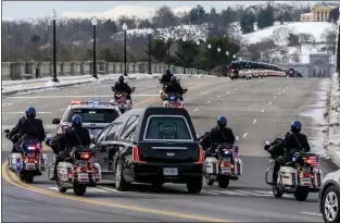  ?? ANDREW HARNIK — THE ASSOCIATED PRESS ?? A hearse carrying the remains of U.S. Capitol Police officer Brian Sicknick makes its way to Arlington National Cemetery after Sicknick was lying in honor at the U.S. Capitol on Feb. 3in Washington. Two men have been charged with assaulting him with bear spray.