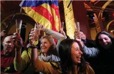  ??  ?? People react to results in Catalonia’s regional elections at a gathering of the Catalan National Assembly (ANC) in Barcelona