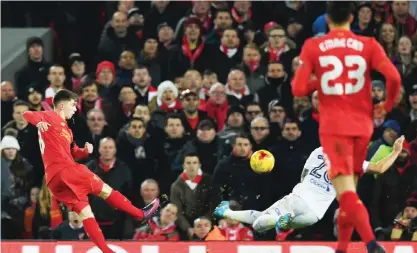  ??  ?? LIVERPOOL: Liverpool’s Welsh striker Ben Woodburn scores his team’s second goal during the English League Cup quarter-final football match between Liverpool and Leeds United at Anfield in Liverpool, north west England on Tuesday.—AFP