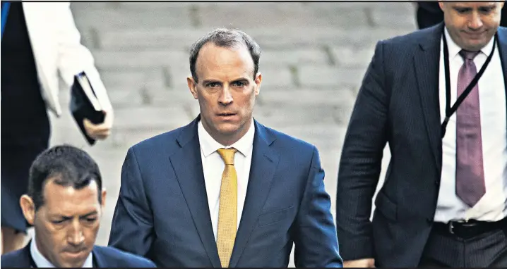  ??  ?? Dominic Raab arrives in Downing Street, where he is standing in for Boris Johnson in key meetings