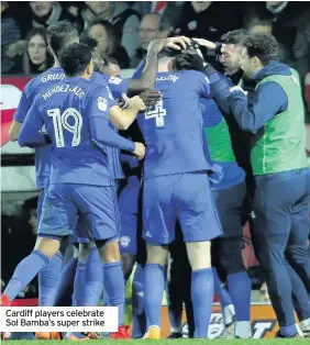  ??  ?? Cardiff players celebrate Sol Bamba’s super strike