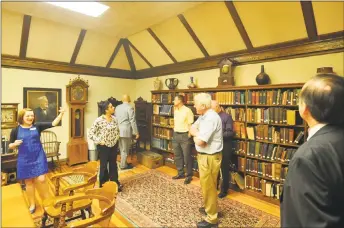  ?? Ben Lambert / Hearst Connecticu­t Media ?? Above and below, led by Torrington Public Library Executive Director Jessica Gueniat, the Torrington-Winsted Rotary Club tours the newly renovated space on Tuesday.
