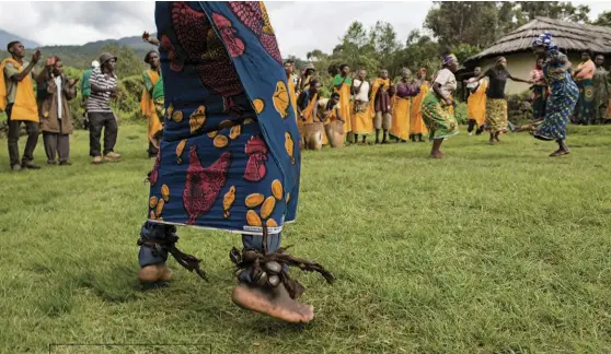  ??  ?? Singers and dancers from the Gahinga Batwa Village perform during a visit to the Mount Gahinga Lodge.